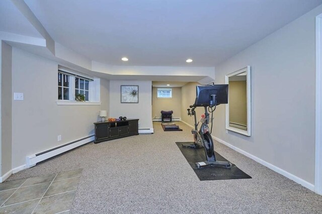 exercise room with baseboard heating, a baseboard heating unit, recessed lighting, baseboards, and carpet