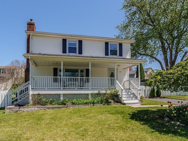 view of front of property featuring a front lawn, covered porch, and a chimney