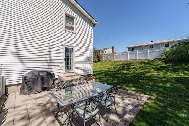 view of patio featuring fence and area for grilling