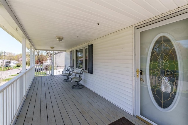 wooden terrace with a porch