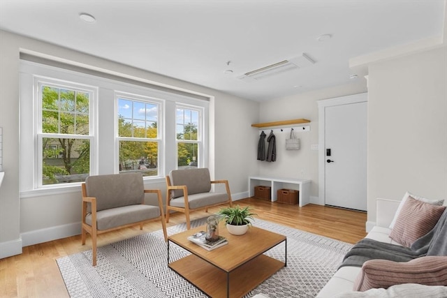 living room with light hardwood / wood-style floors