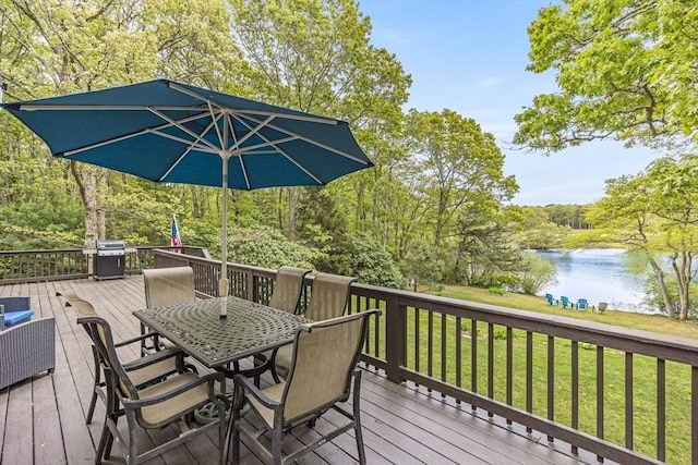 51 Wianno Cir, Barnstable, MA 02655 - wooden deck featuring a water view, outdoor dining area, and a lawn