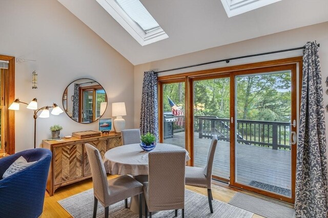 51 Wianno Cir, Barnstable, MA 02655 - dining area with a skylight, plenty of natural light, light wood finished floors, and high vaulted ceiling