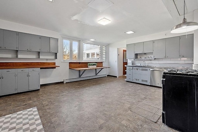 kitchen featuring gray cabinetry, dishwasher, baseboard heating, and hanging light fixtures