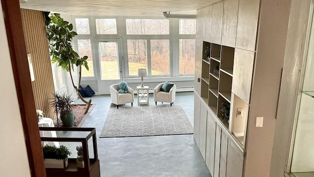 sunroom featuring baseboard heating