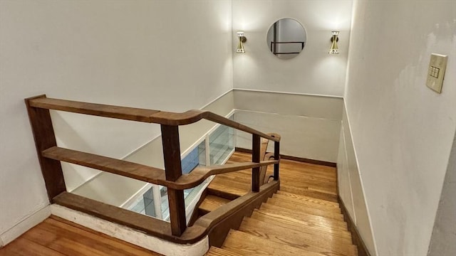 stairs with wood-type flooring