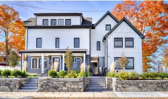 view of front of property featuring stairs