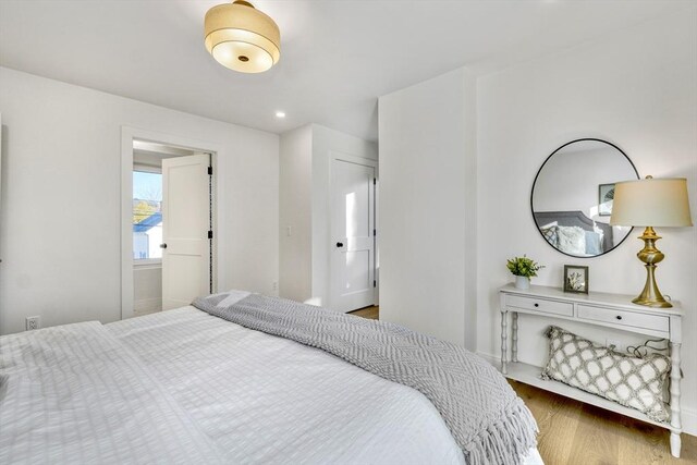 bedroom featuring wood finished floors and recessed lighting