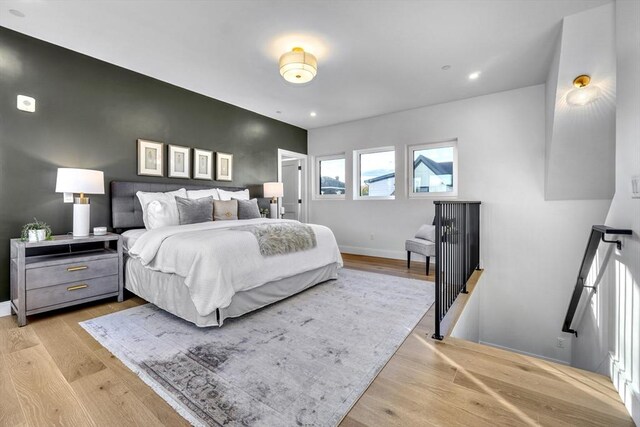 bedroom featuring recessed lighting, baseboards, and light wood finished floors