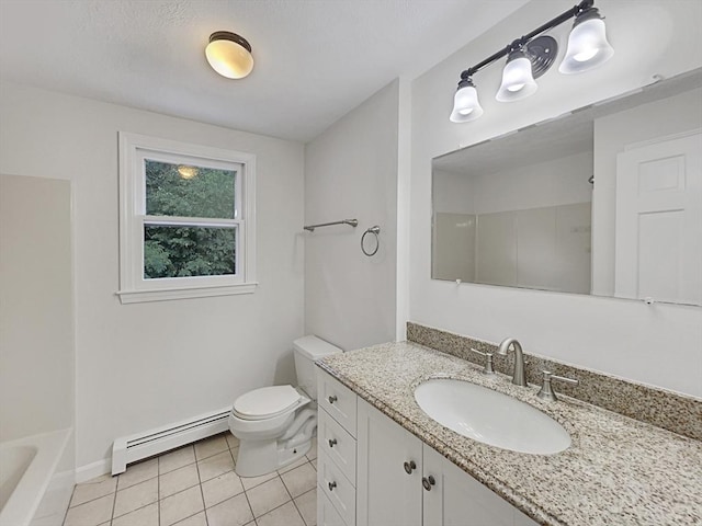 bathroom featuring toilet, baseboard heating, vanity, tile patterned flooring, and baseboards