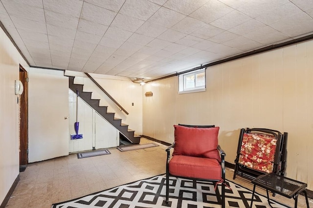 unfurnished room featuring stairs and tile patterned floors