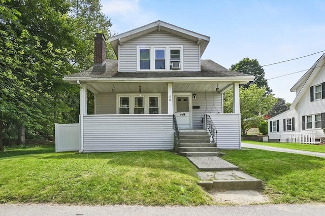 16 Boyce St, Worcester, MA 01603 - bungalow-style home with a front yard, a chimney, covered porch, and roof with shingles