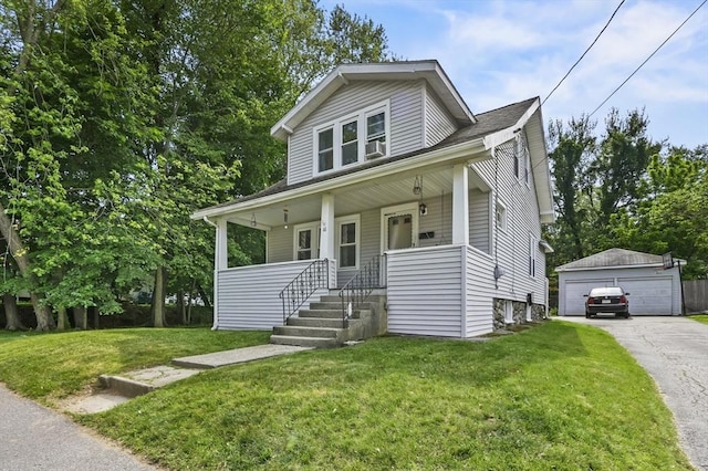 16 Boyce St, Worcester, MA 01603 - view of front facade featuring an outbuilding, a detached garage, a porch, and a front lawn