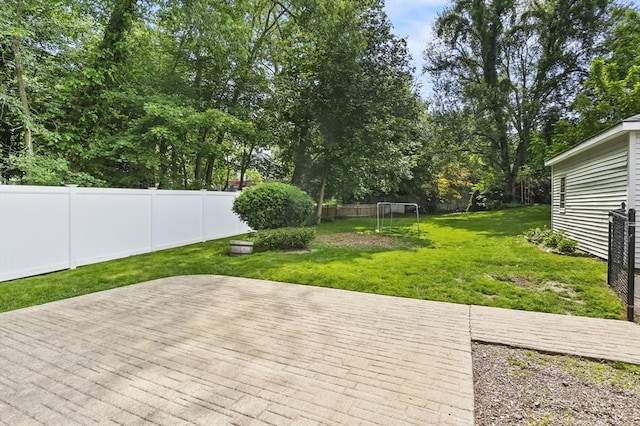 16 Boyce St, Worcester, MA 01603 - fenced backyard featuring view of wooded area and a wooden deck
