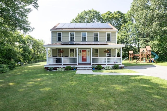 15 Rose Ln, Uxbridge, MA 01569 - view of front of property with a porch, solar panels, a front yard, and a playground