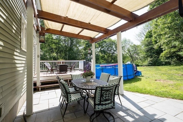 15 Rose Ln, Uxbridge, MA 01569 - view of patio featuring outdoor dining area, an outdoor pool, a deck, and view of wooded area