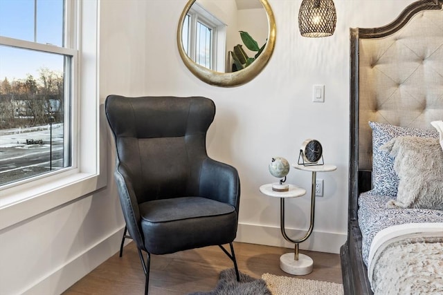 sitting room with wood finished floors and baseboards