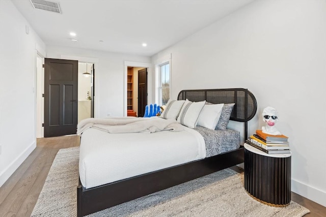 bedroom featuring recessed lighting, baseboards, visible vents, and light wood finished floors