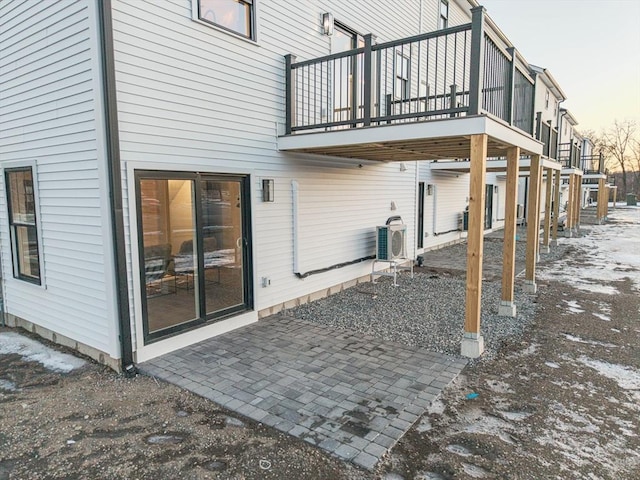 back of property featuring a patio area, ac unit, and a carport