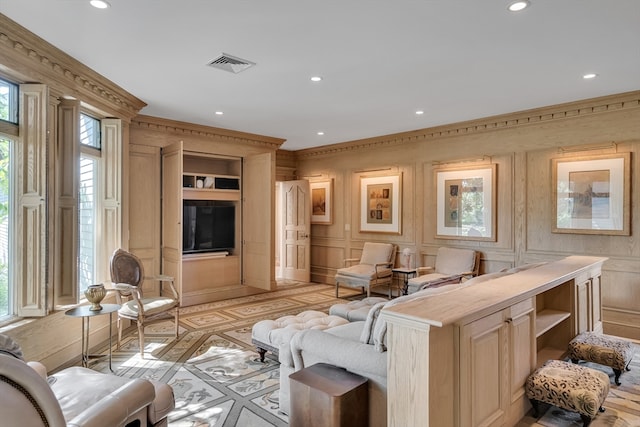 living room with ornamental molding