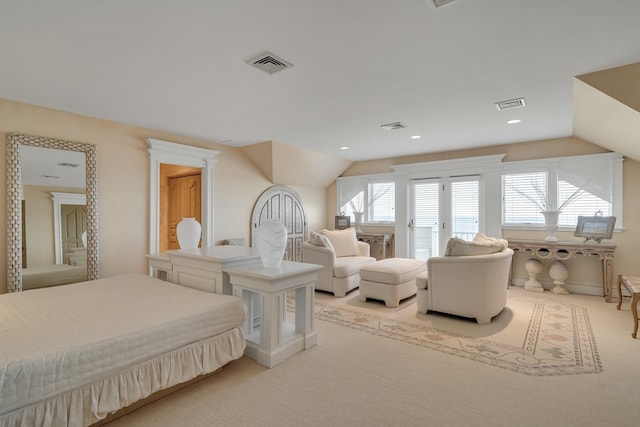 carpeted bedroom featuring lofted ceiling