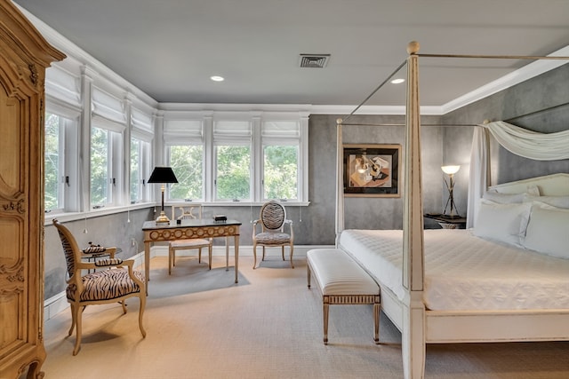 carpeted bedroom featuring crown molding