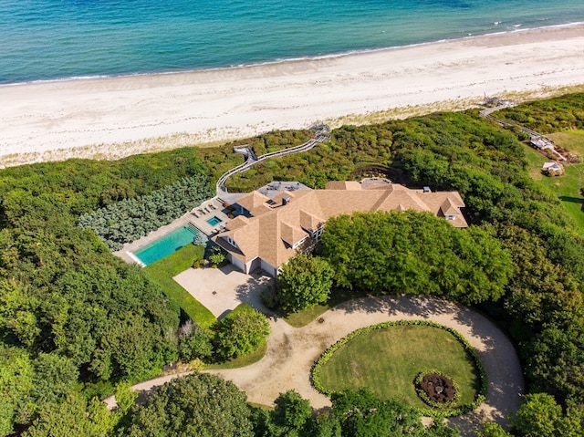 bird's eye view featuring a water view and a view of the beach