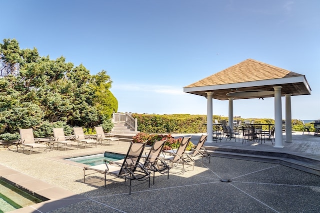 view of patio featuring a gazebo and a swimming pool