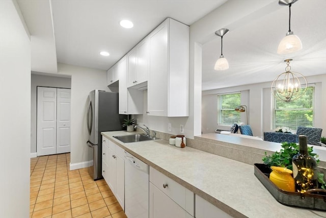 1 Loring Ave Unit 206, Swampscott, MA 01907 - kitchen with dishwasher, a sink, light countertops, white cabinetry, and recessed lighting