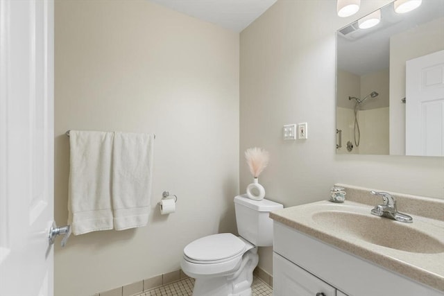 1 Loring Ave Unit 206, Swampscott, MA 01907 - bathroom with toilet, vanity, a shower, tile patterned floors, and baseboards