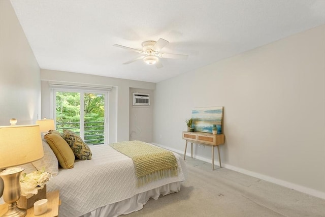 1 Loring Ave Unit 206, Swampscott, MA 01907 - carpeted bedroom featuring a wall mounted AC, baseboards, and a ceiling fan