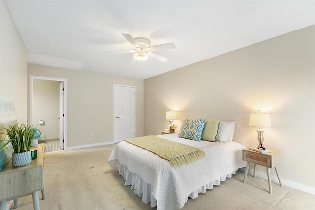 1 Loring Ave Unit 206, Swampscott, MA 01907 - bedroom with baseboards, light carpet, and ceiling fan