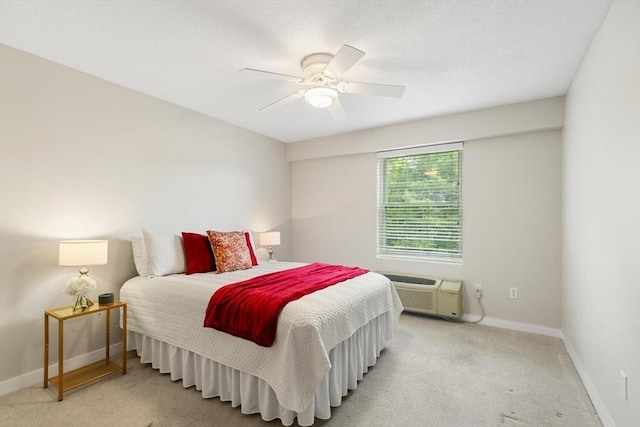 1 Loring Ave Unit 206, Swampscott, MA 01907 - carpeted bedroom with baseboards, a ceiling fan, and a wall mounted AC