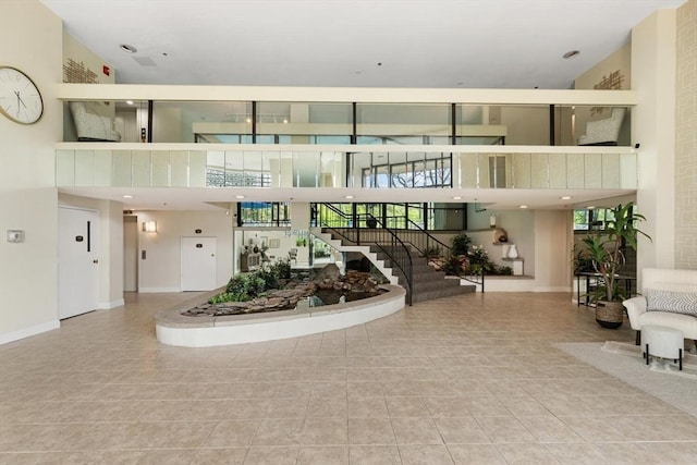 1 Loring Ave Unit 206, Swampscott, MA 01907 - building lobby with a high ceiling and stairs
