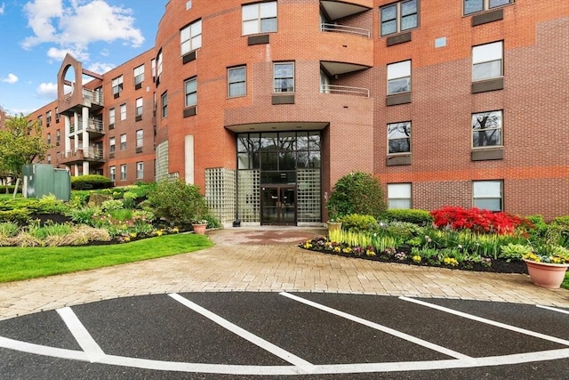 1 Loring Ave Unit 206, Swampscott, MA 01907 - view of apartment building / complex with uncovered parking