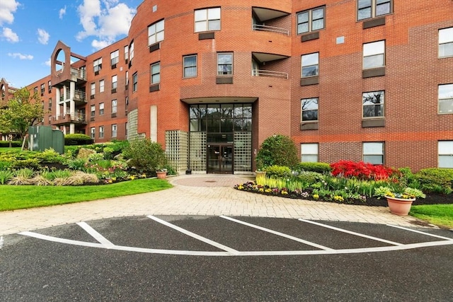1 Loring Ave Unit 206, Swampscott, MA 01907 - view of apartment building / complex featuring uncovered parking