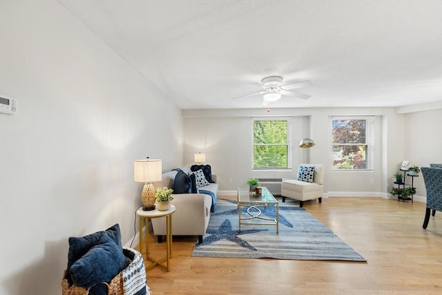 1 Loring Ave Unit 206, Swampscott, MA 01907 - living area featuring light wood-style floors, a ceiling fan, and baseboards