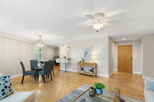 1 Loring Ave Unit 206, Swampscott, MA 01907 - living area with light wood-style floors, a chandelier, baseboards, and ceiling fan