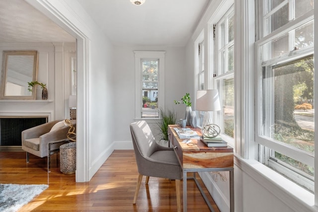 office area with light hardwood / wood-style flooring