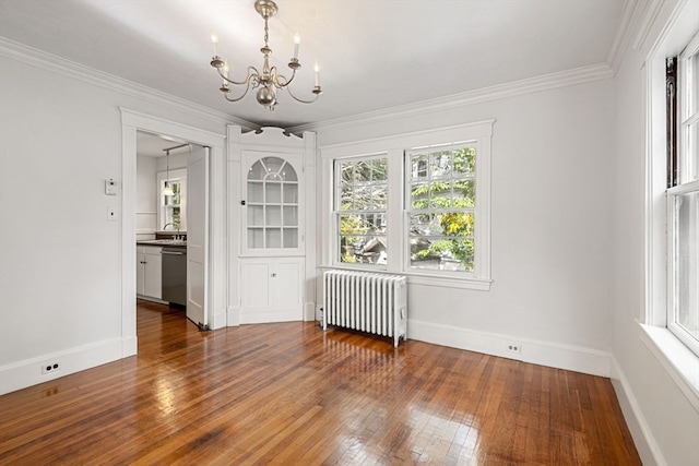 unfurnished dining area featuring ornamental molding, radiator, an inviting chandelier, and dark wood-type flooring