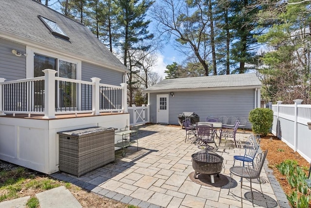 view of patio featuring outdoor dining area, a gate, and a fenced backyard