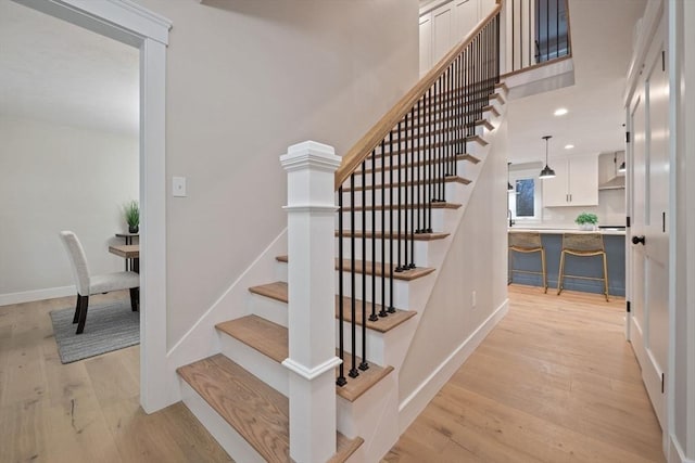 staircase featuring hardwood / wood-style floors