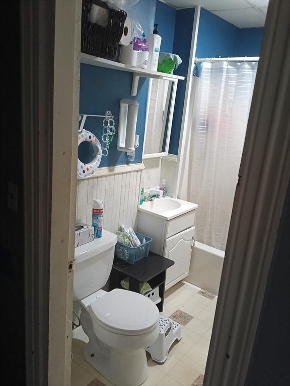 248 S Main St, Attleboro, MA 02703 - bathroom featuring toilet, vanity, and shower / bath combination with curtain