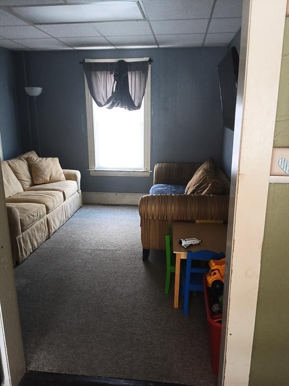 248 S Main St, Attleboro, MA 02703 - carpeted living area with a paneled ceiling