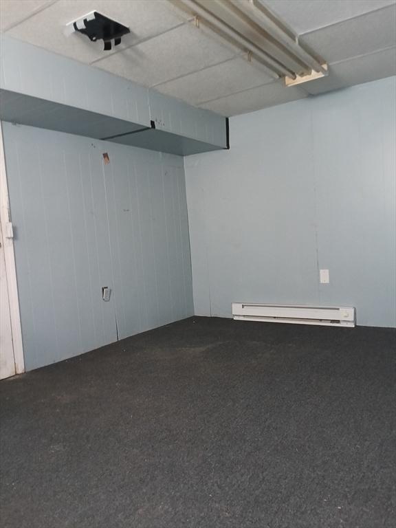 248 S Main St, Attleboro, MA 02703 - finished below grade area featuring a baseboard radiator, carpet, and wood walls