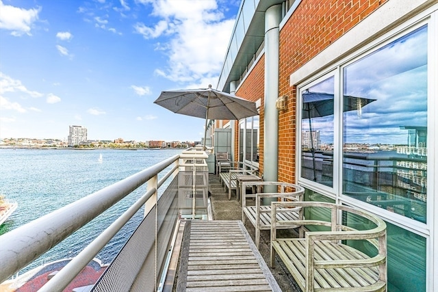 balcony featuring a water view