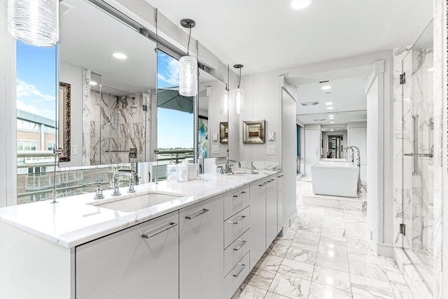 bathroom featuring vanity and shower with separate bathtub