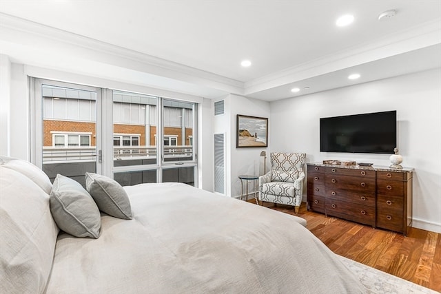 bedroom with hardwood / wood-style floors