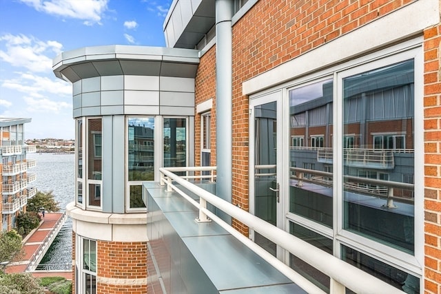 balcony featuring a water view