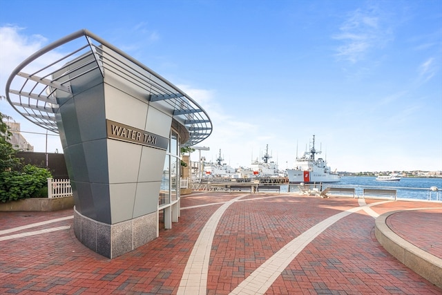 surrounding community featuring a water view